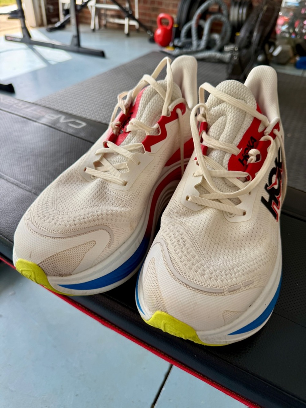 Hoka Men's Cream Running Shoes with Red, Blue and Yellow Accents